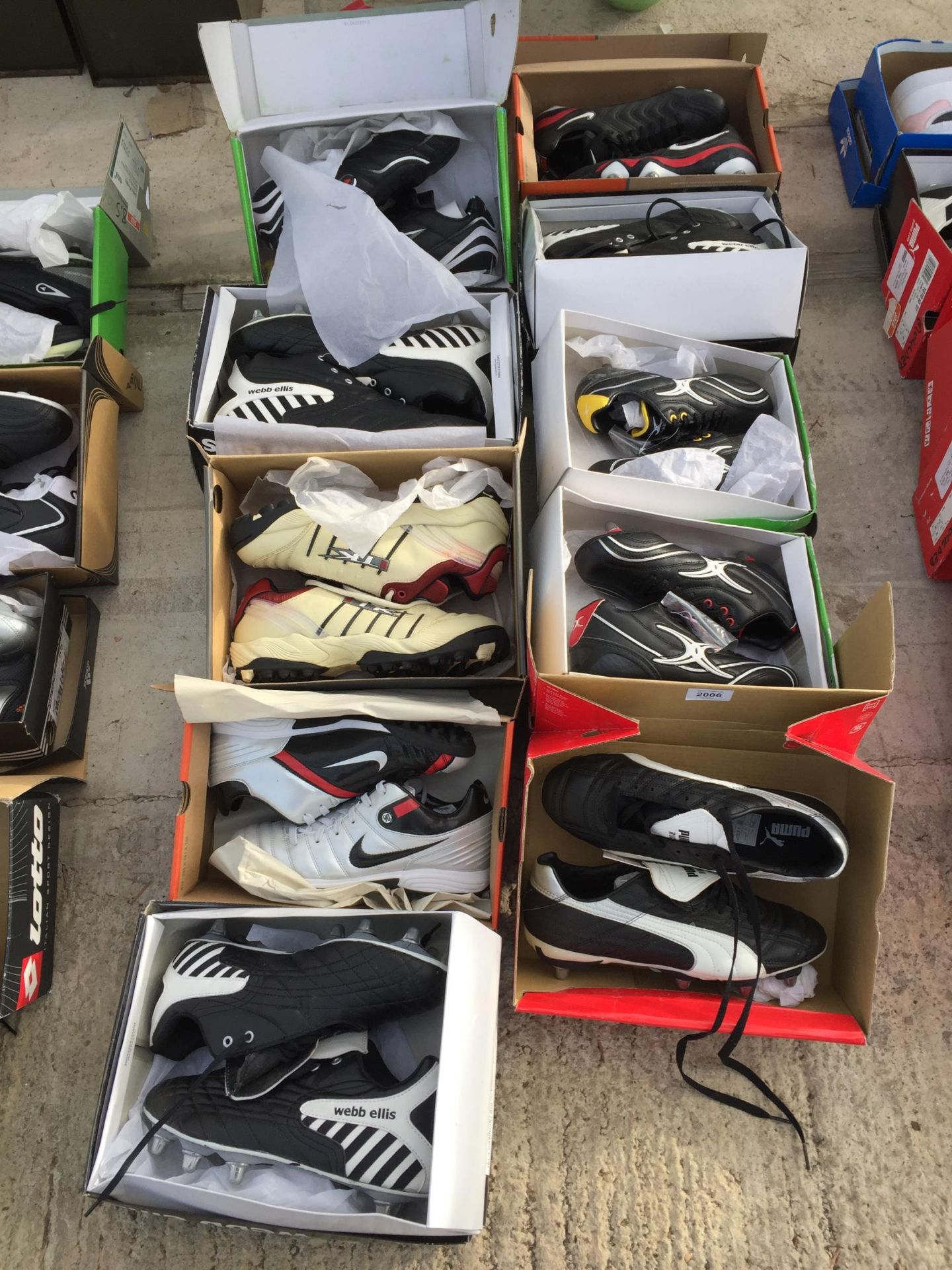 TEN PAIRS OF AS NEW AND BOXED SPORTS BOOTS AND TRAINERS