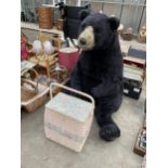 A LARGE TEDDY BEAR AND A WICKER SEWING BOX