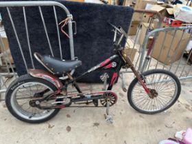 A RETRO STRINGRAY LOW RIDER BIKE WITH LARGE BACK WHEEL