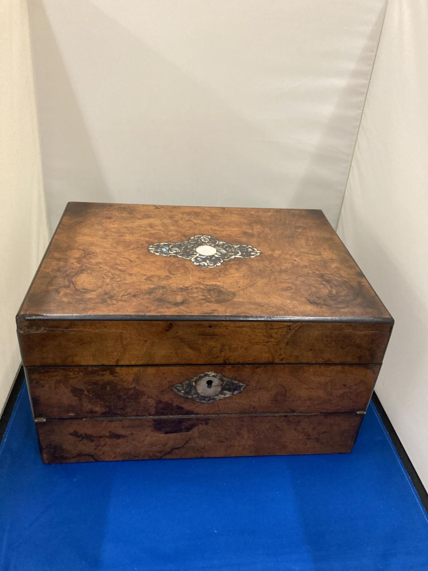 AN UNUSUAL WALNUT AND INLAID MOTHER OF PEARL SEWING BOX AND WRITING SLOPE