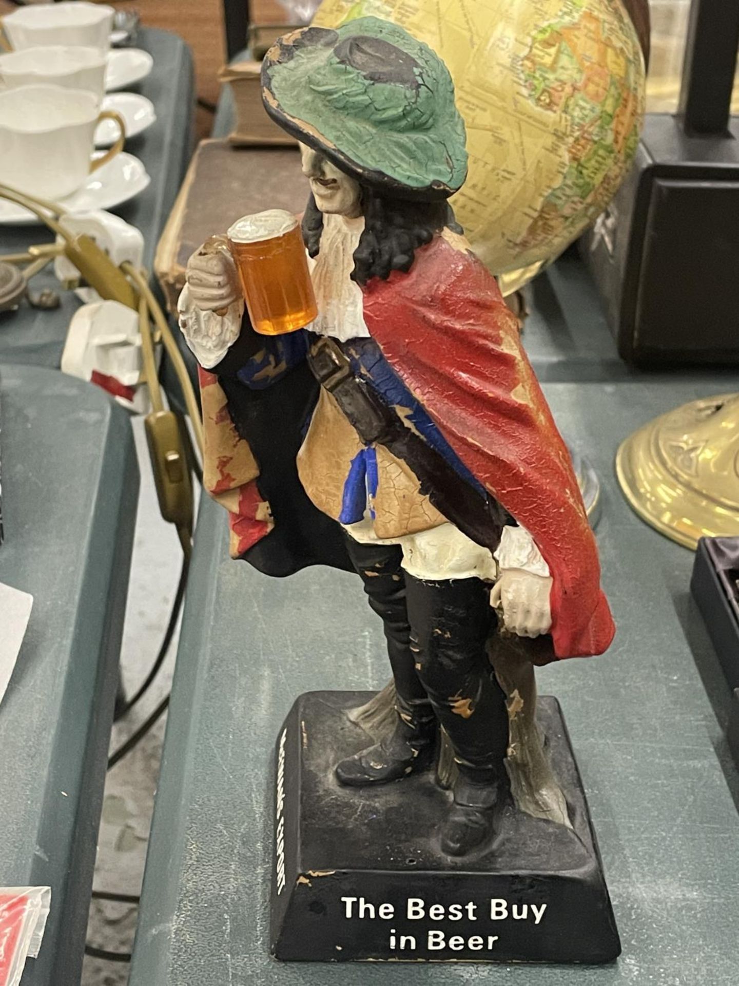 A 1950'S 'McEWANS EXPORT' CAVALIER BAR FIGURE, HEIGHT 24CM