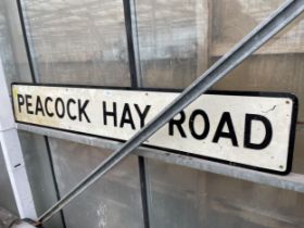 A LARGE METAL 'PEACOCK HAY ROAD' ROAD SIGN