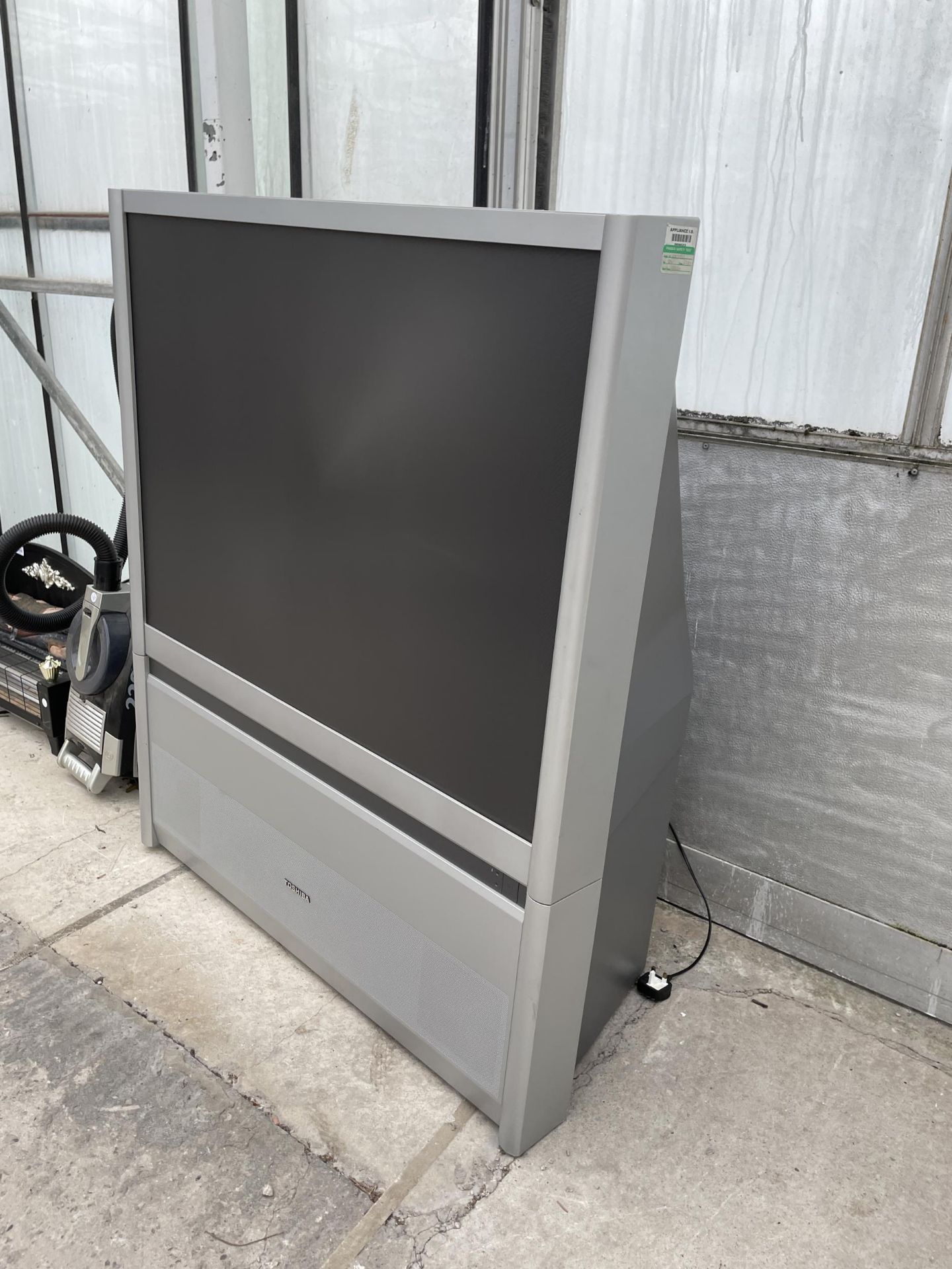 A TOSHIBA 43" TELEVISION ON STAND