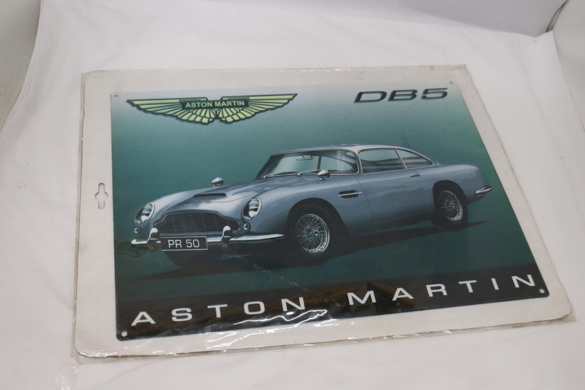 AN ASTON MARTIN DB 5 METAL SIGN, 40CM X 30CM