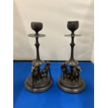 A PAIR OF BRONZE CANDLESTICKS WITH LURCHER DESIGN, HEIGHT 20CM