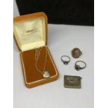 FIVE ITEMS TO INCLUDE A SILVER LOCKET INA PRESENTATION BOX, THREE SILVER RINGS AND A WHITE METAL