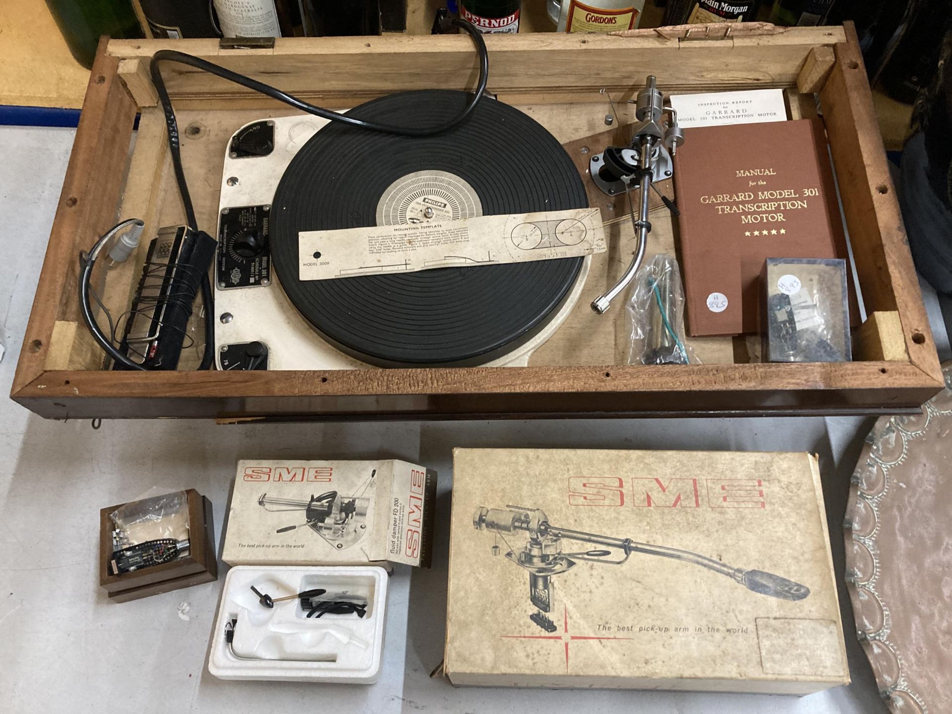 A GARRARD 301 TURNTABLE WITH INSTRUCTION, INSPECTION REPORT BOOK 3009 SME ARM, HEAD TYPE II IN