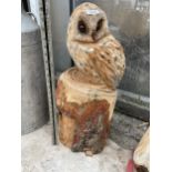 AN OWL CHAINSAW CARVING (H:65CM)