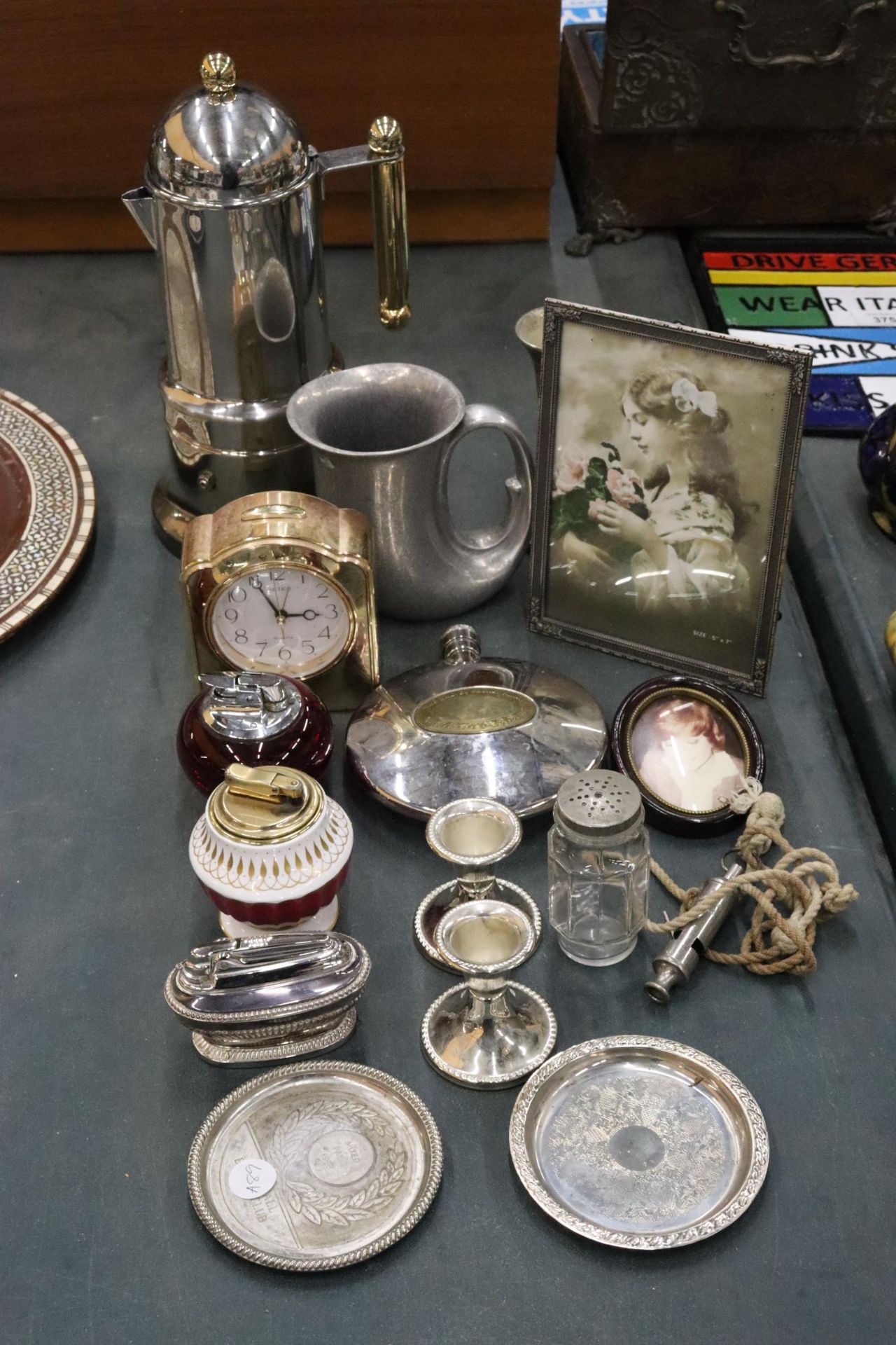 A QUANTITY OF ITEMS TO INCLUDE A CHROME ITALIAN COFFEE POT, TABLE LIGHTERS, CANDLE STICKS, A HIP
