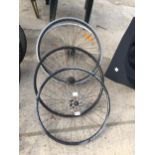 FOUR VARIOUS RACING BIKE WHEELS