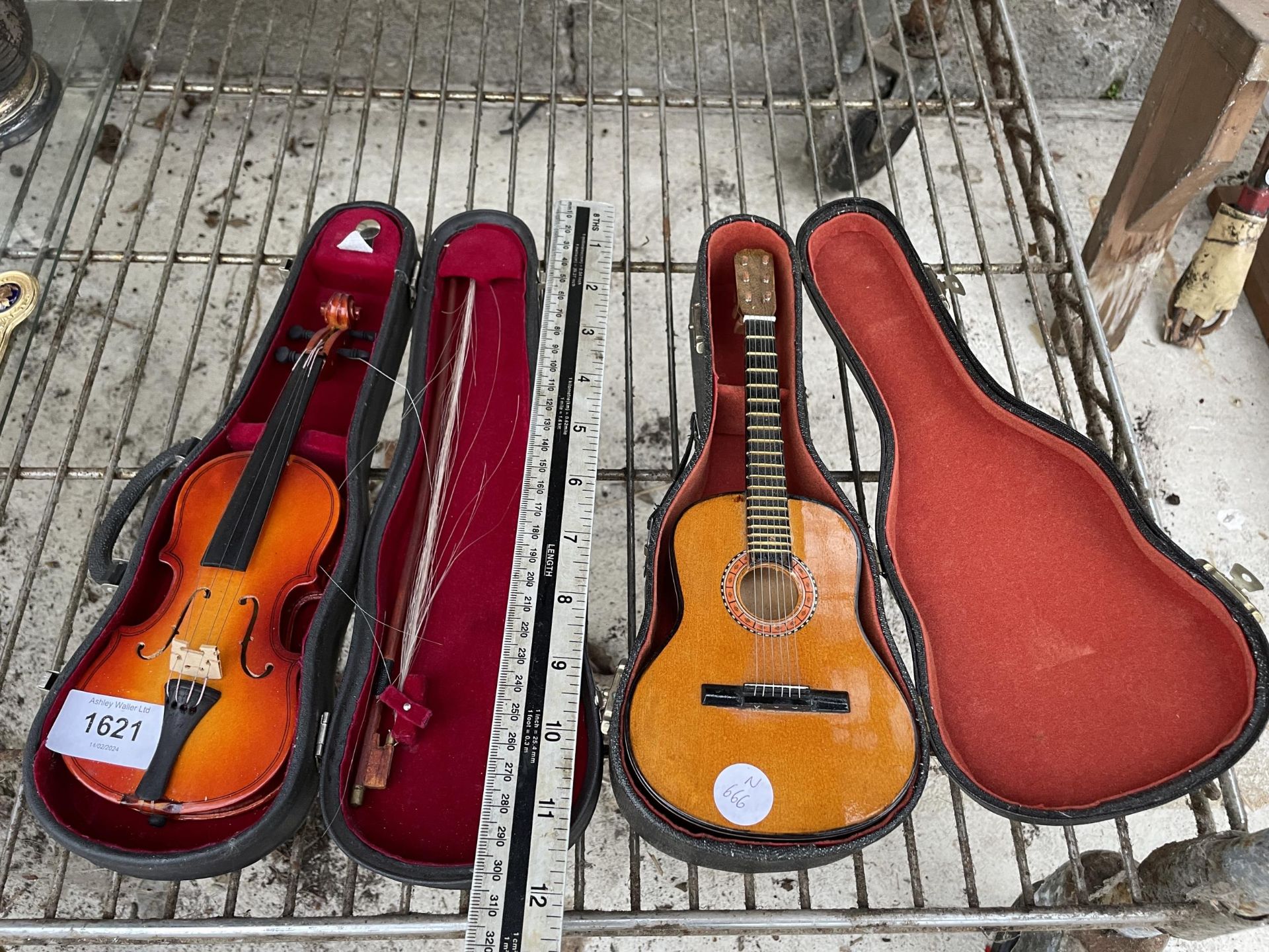 TWO MINIATURE CASED MUSICAL INSTRUMENTS TO INCLUDE A VIOLIN WITH BOW AND A GUITAR