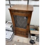 AN OAK RECORD CABINET CONTAINING A SONY COMPACT HI-FI STEREO SYSTEM