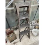 A VINTAGE THREE RUNG WOODEN STEP LADDER