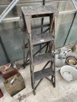 A VINTAGE THREE RUNG WOODEN STEP LADDER