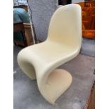 A PLASTIC PANTON STYLE CHAIR ON CANTILEVER BASE