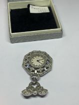 AN AMERICAN 1930'S ENVOY BROOCH WATCH WITH CLEAR STONE DECORATION SEEN WORKING BUT NO WARRANTY