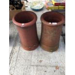 A PAIR OF VINTAGE TERRACOTTA CHIMNEY POTS