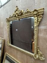 A 19TH CENTURY GILT FRAMED OVER MANTLE MIRROR