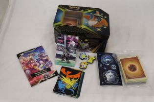 A POKEMON COLLECTORS TIN FULL OF CARDS, DIVIDERS AND EXTRAS