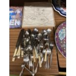 A QUANTITY OF FLATWARE AND A BOXED VINTAGE NAPKIN SET