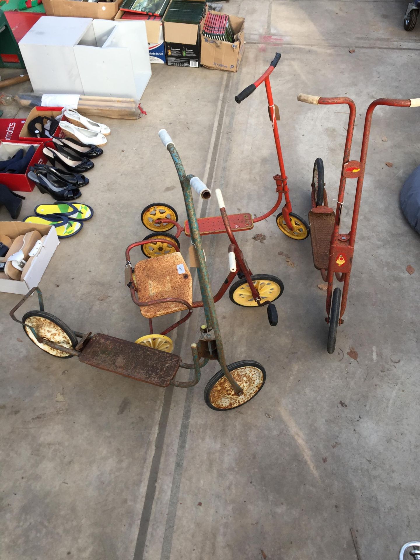 THREE VINTAGE CHILDS SCOOTERS AND A CHILDS TRICYCLE