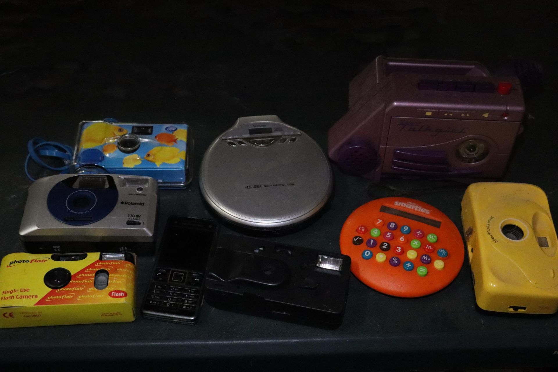 A COLLECTION OF FIVE CAMERAS, A PORTABLE CD PLAYER, 'TALKGIRL' CASSETTE PLAYER AND A SMARTIES