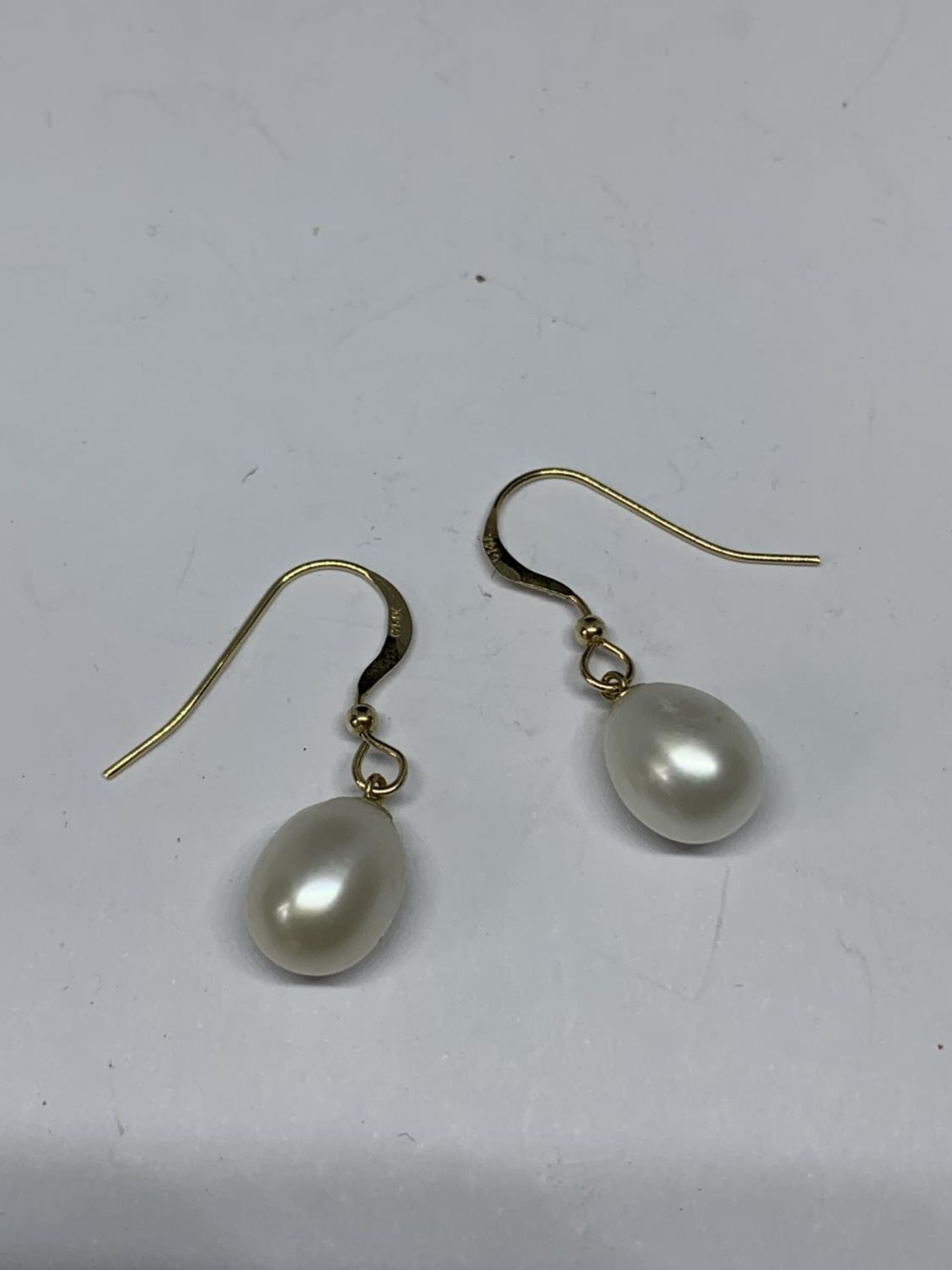 A PAIR OF 14 CARAT GOLD AND PEARL EARRINGS GROSS WEIGHT 2.45 GRAMS