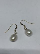 A PAIR OF 14 CARAT GOLD AND PEARL EARRINGS GROSS WEIGHT 2.45 GRAMS