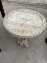 AN 18" DIAMETER ORIENTAL STYLE RESIN TABLE WITH INSET GLASS TOP