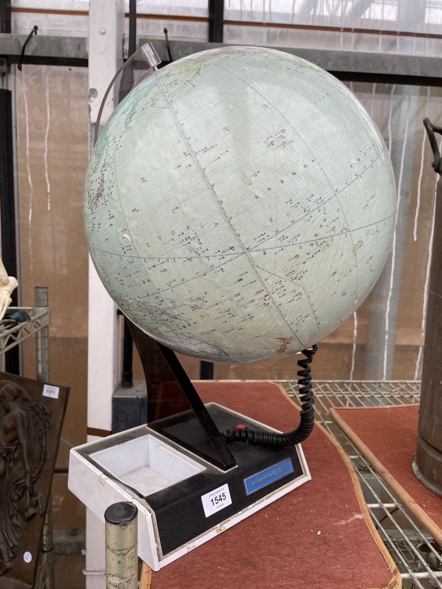 A RETRO KODANSHA GLOBE ON A STAND