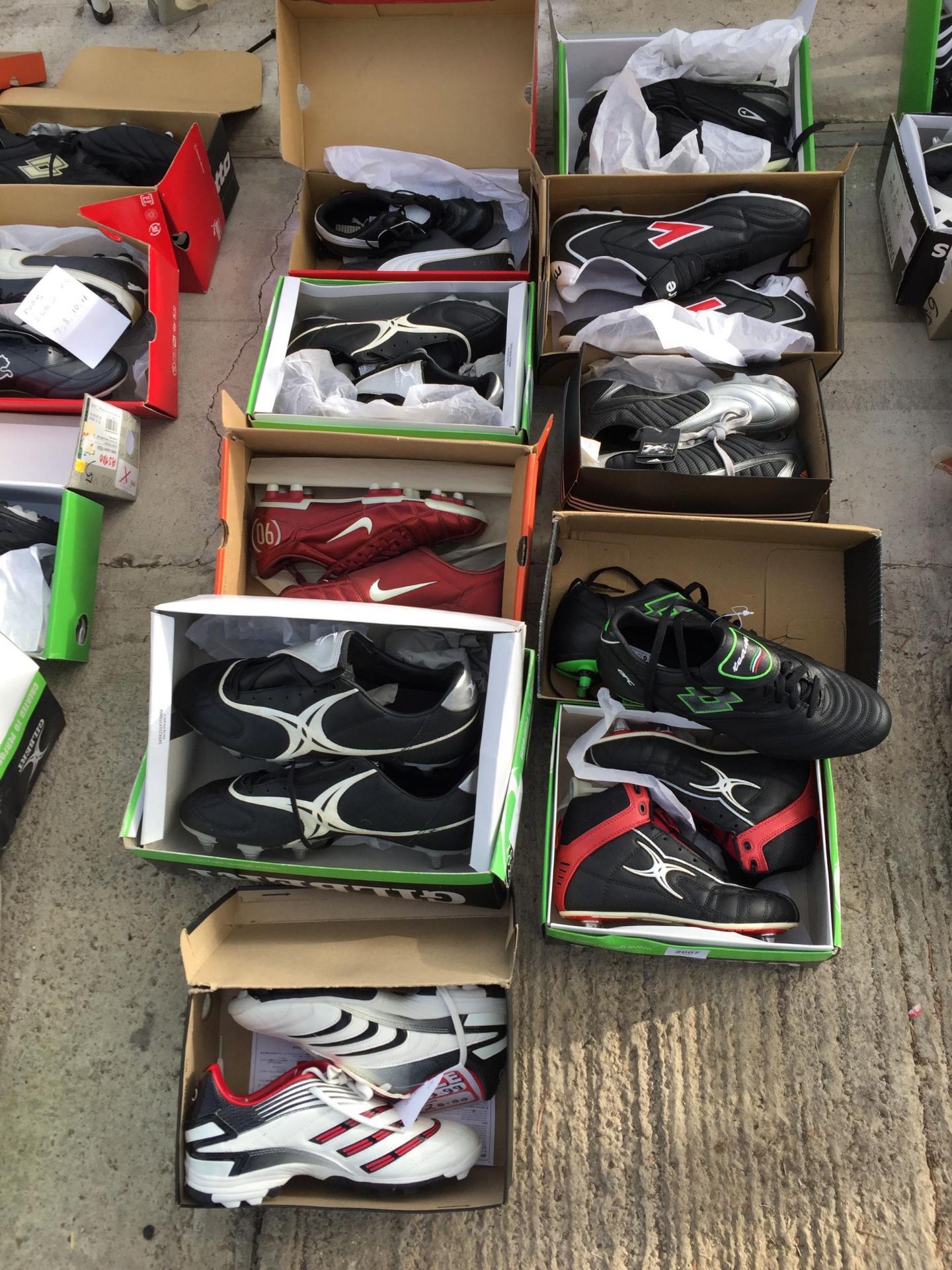 TEN PAIRS OF AS NEW AND BOXED SPORTS BOOTS AND TRAINERS