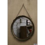 A VINTAGE ROUND MIRROR WITH GILT AND GREEN FRAME, AND CHAIN HANGING, DIAMETER 40CM