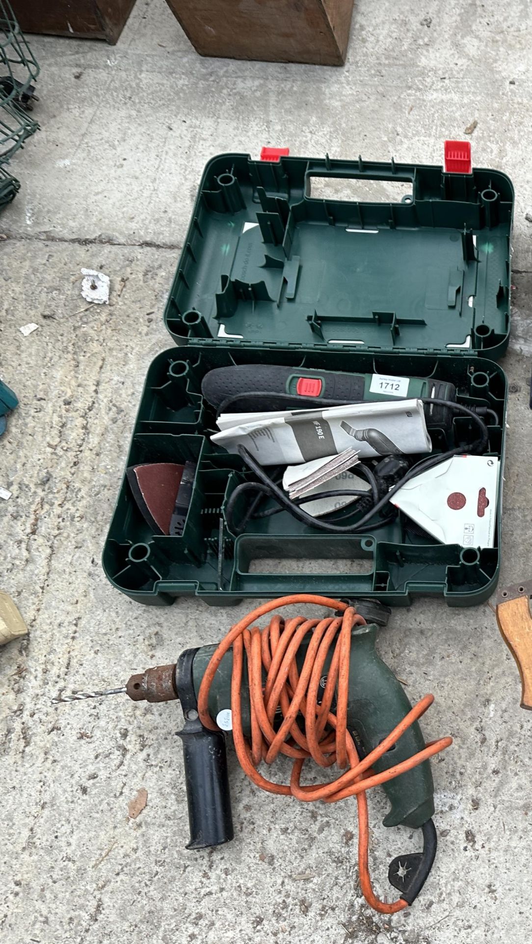 A BOSCH ELECTRIC MULTITOOL AND AN ELECTRIC DRILL