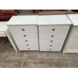 A PAIR OF MODERN WHITE CHESTS OF FIVE DRAWERS - EACH 24 INCH WIDE