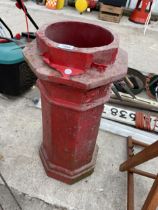 A RED PAINTED CHIMNEY POT