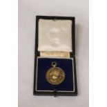 A BIRMINGHAM HALLMARKED SILVER 'THE FOOTBALL LEAGUE REPRESENTITIVE MATCH' MEDAL PRESENTED TO A