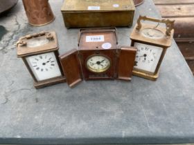 THREE VARIOUS CLOCKS TO INCLUDE TWO BRASS CARRIAGE CLOCK AND AN OAK CASED CLOCK