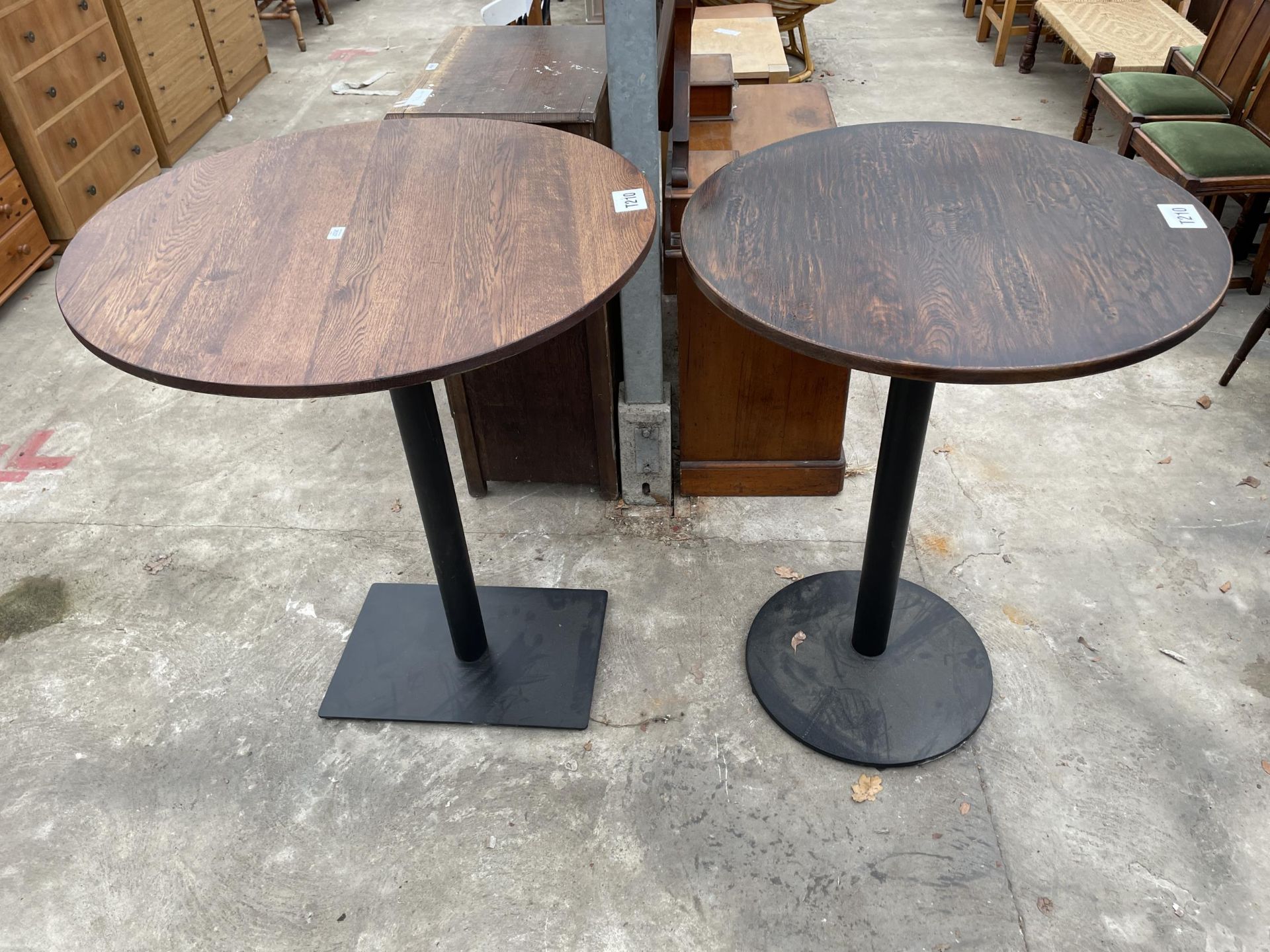 A PUB TABLE ON A METALWARE BASE 36" DIAMETER AND A SIMILAR TABLE 32" DIAMETER