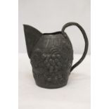 A VINTAGE PEWTER WINE JUG IN THE FORM OF A BARREL WITH GRAPE AND VINE DECORATION, HEIGHT 19CM