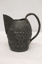 A VINTAGE PEWTER WINE JUG IN THE FORM OF A BARREL WITH GRAPE AND VINE DECORATION, HEIGHT 19CM