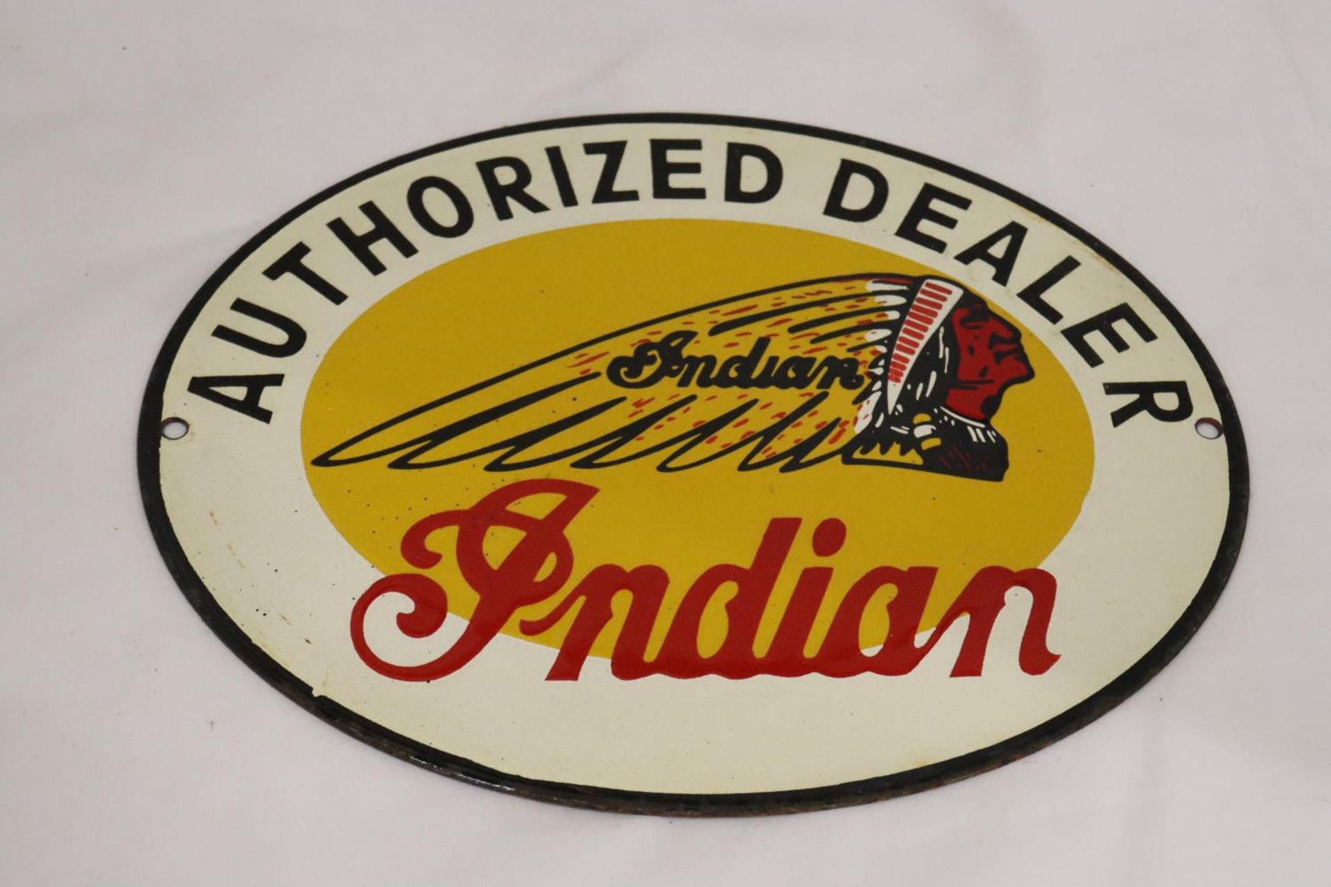 AN ENAMEL INDIAN MOTORCYCLES SIGN, 28CM X 22CM