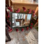 A WALL MIRROR DECORATED WITH METALWARE POPPIES 31" X 28"