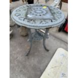 A SMALL CAST IRON BISTRO TABLE