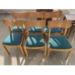 A SET OF SIX RETRO OAK DINING CHAIRS