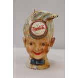 A VINTAGE CAST IRON 'COCA-COLA' BOY MONEY BOX, HEIGHT 20CM