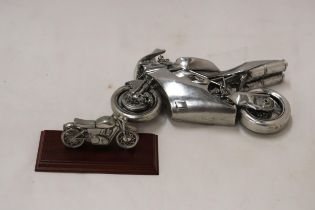 A ROYAL HAMPSHIRE PEWTER MOTOR BIKE ON A STAND PLUS A HEAVY CHROMED MOTOR BIKE