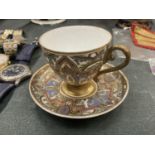A CONTINENTAL, ENAMELLED AND GILDED, CUP AND SAUCER
