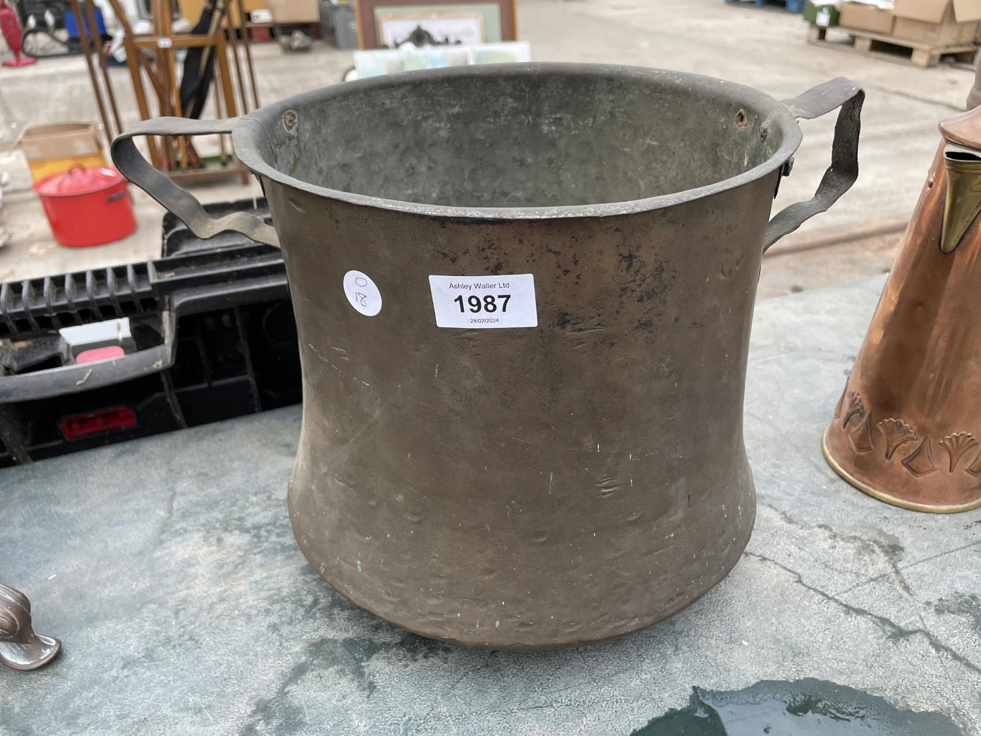 A VINTAGE BRASS TWIN HANDLE POT