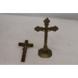 A STAND UP BRASS CRUCIFIX AND WALL HANGING CRUCIFIX