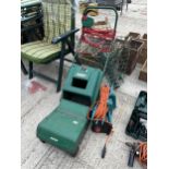 AN ELECTRIC QUALCAST LAWN MOWER, AN ELECTRIC STRIMMER AND AN ELECTRIC BLACK AND DECK HEDGE CUTTER